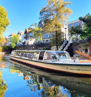 a boat is docked on a canal in a city