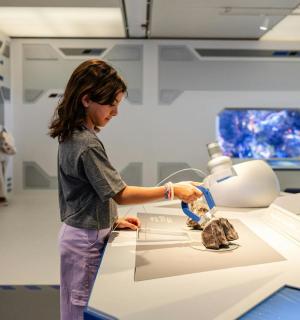 a young woman in a hospital room with a machine