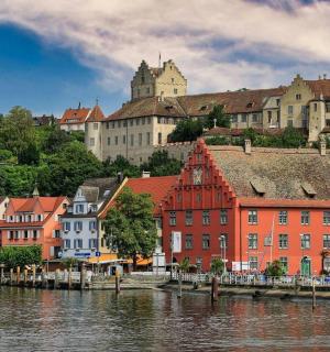 a group of buildings next to a body of water