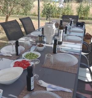a long table with wine bottles and food on it