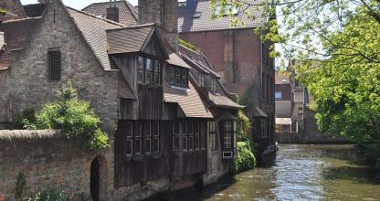 a group of buildings next to a river