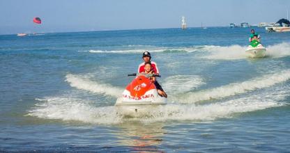 two people riding on a boat in the water
