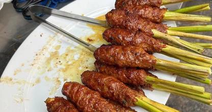 a plate of food with meat and asparagus