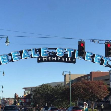 a traffic light with a sign for beale street memphis