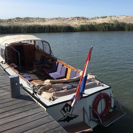 a boat is docked at a dock on the water