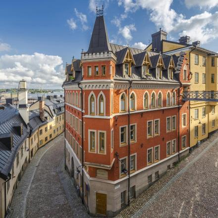 an old building with a tower on a city street