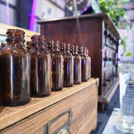a row of bottles sitting on top of a wooden crate