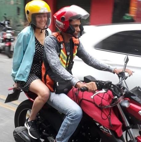 a man and a woman riding on a motorcycle
