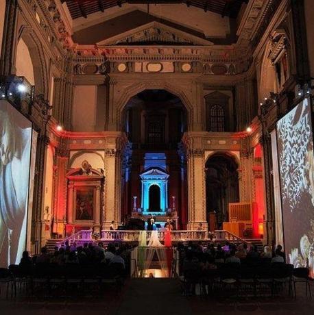 a large room with a stage in a building