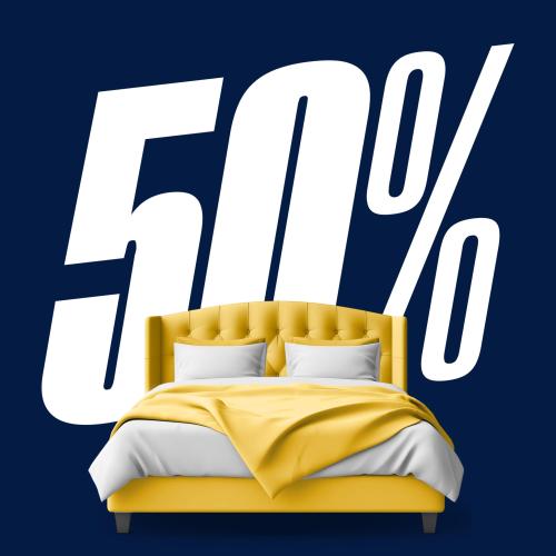 A comfy bed and a sign that says 50%