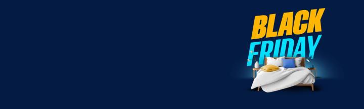 Un letto matrimoniale davanti al grande logo del Black Friday