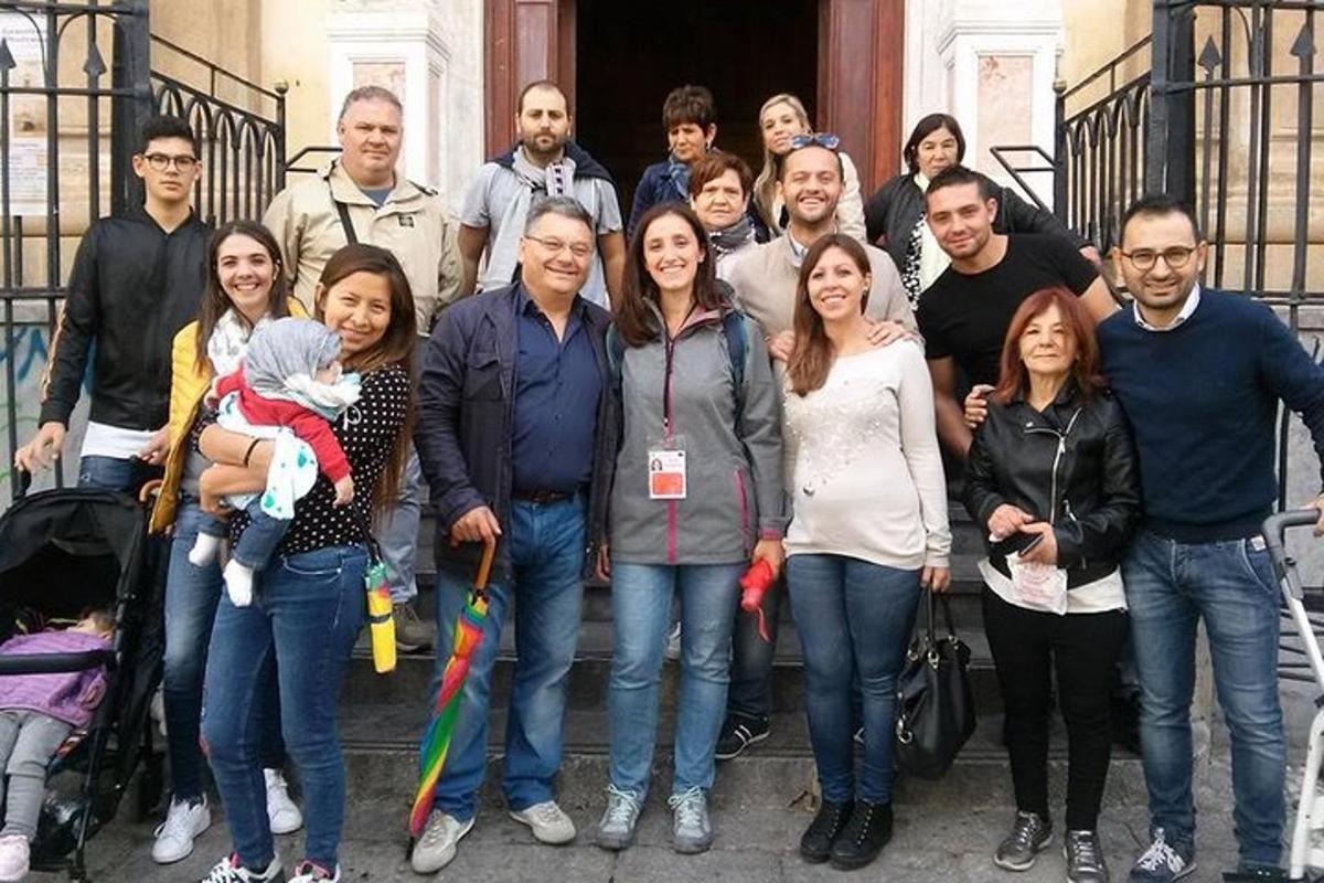 a group of people standing on the steps of a building