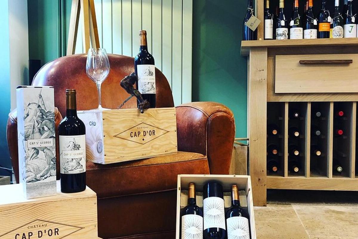 a crate of wine bottles and a wine glass