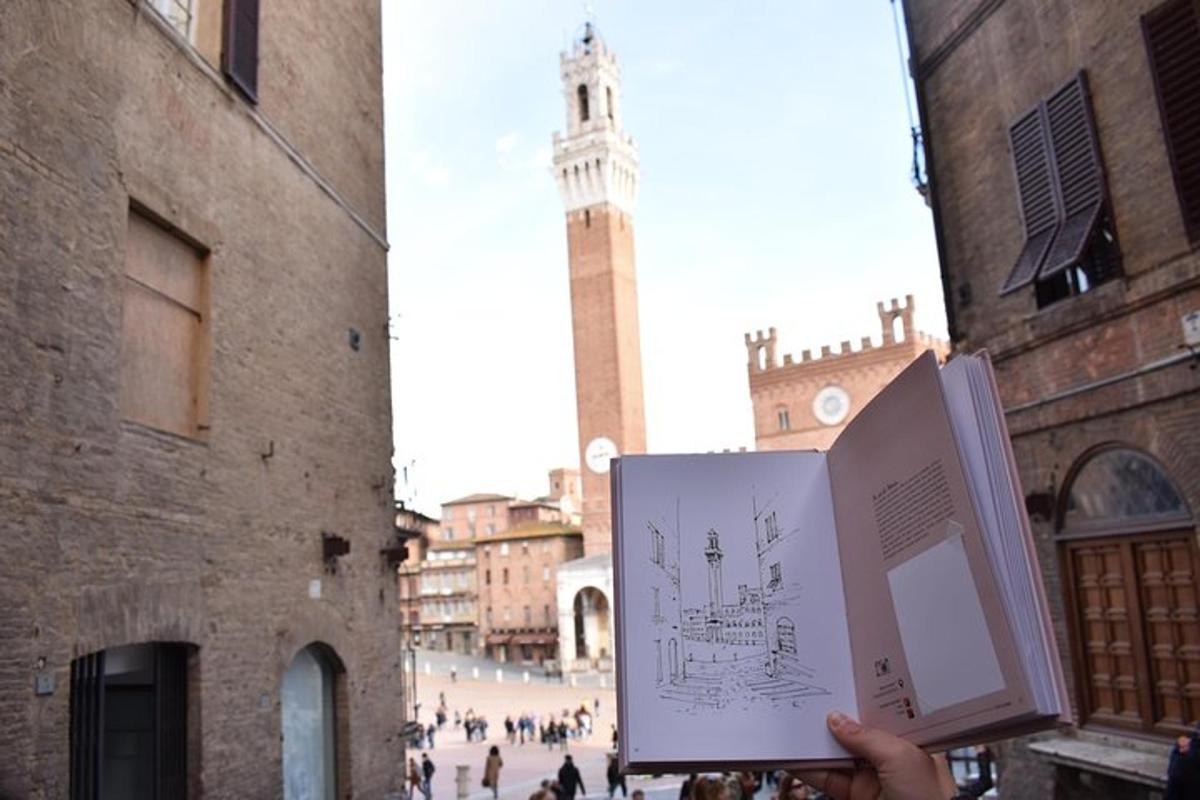 una persona che tiene un cartello in una città con una torre dell'orologio
