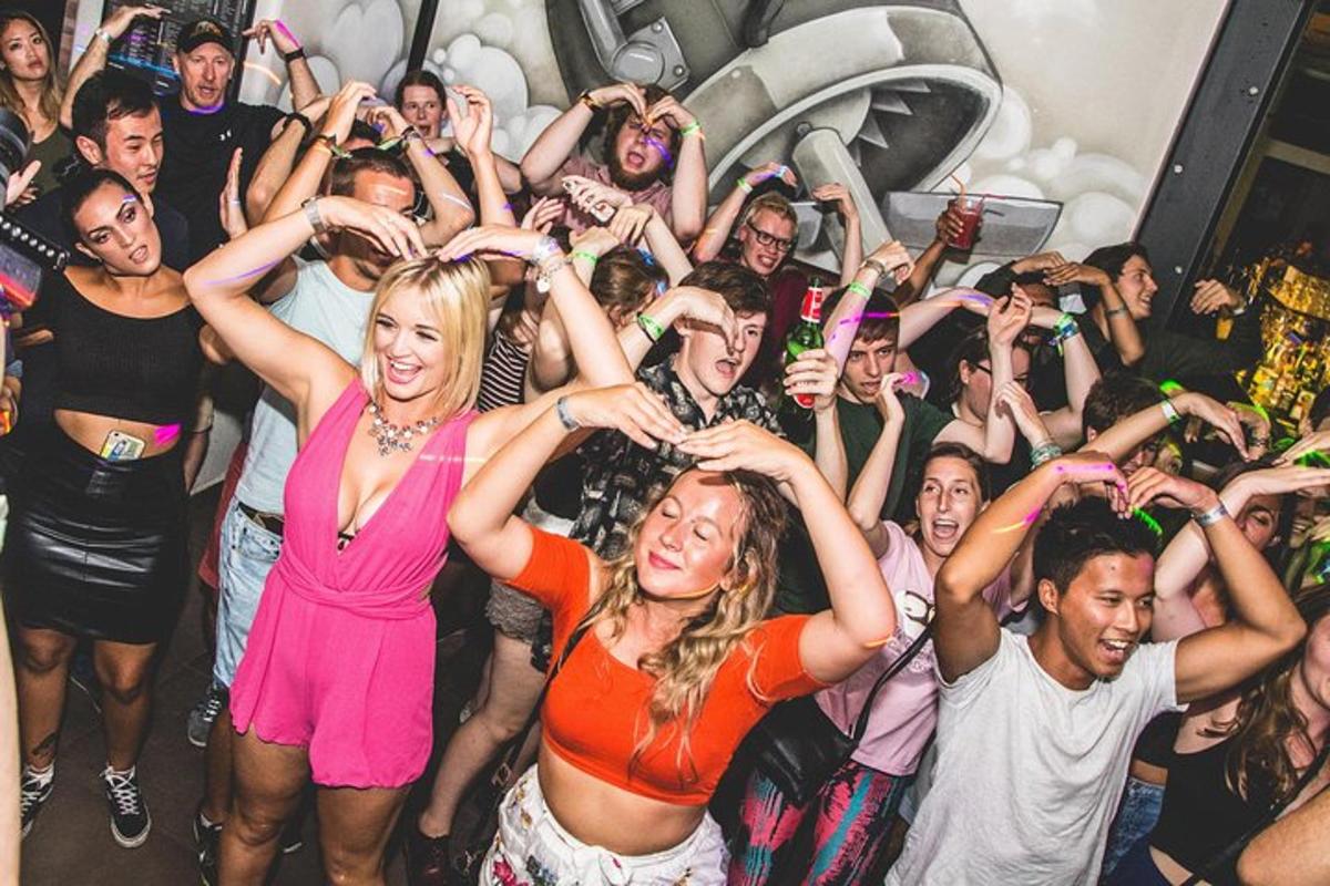 a group of people dancing in a party