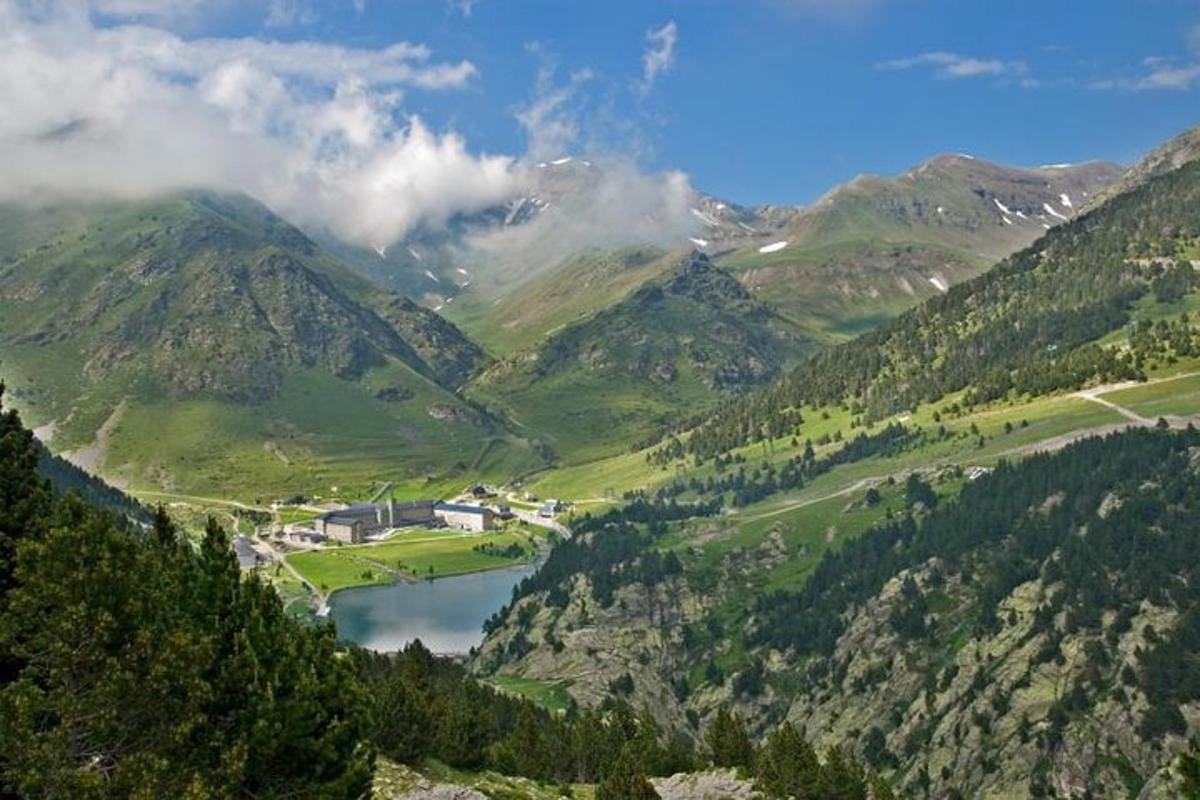 a view of a mountain valley with a lake