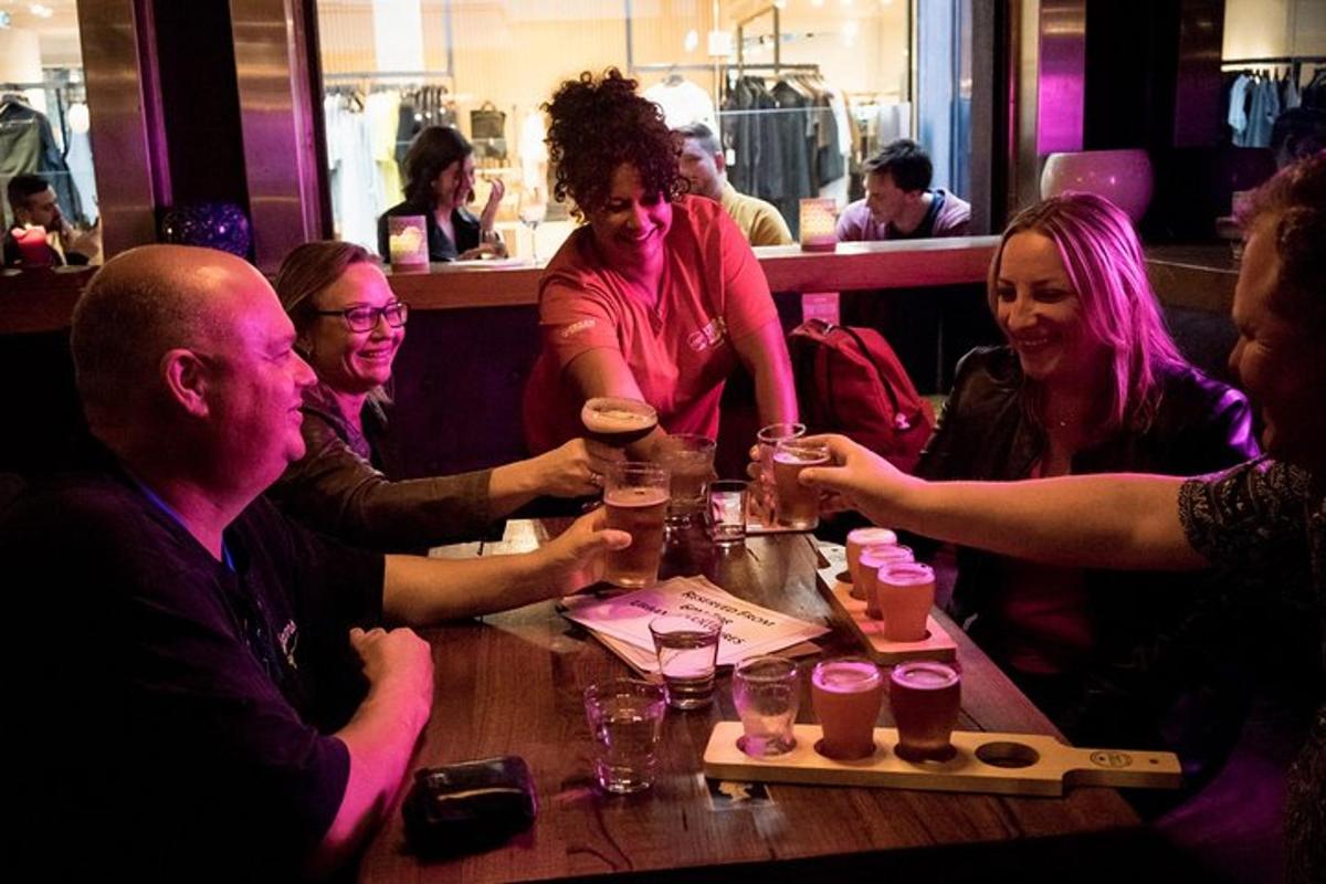 a group of people sitting around a table in a restaurant