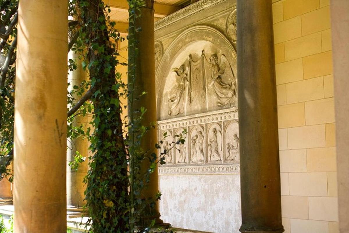 an ornate stone wall in a building with ivy