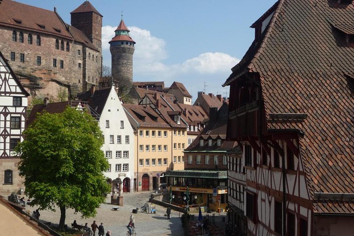 a group of buildings in a city with a tower