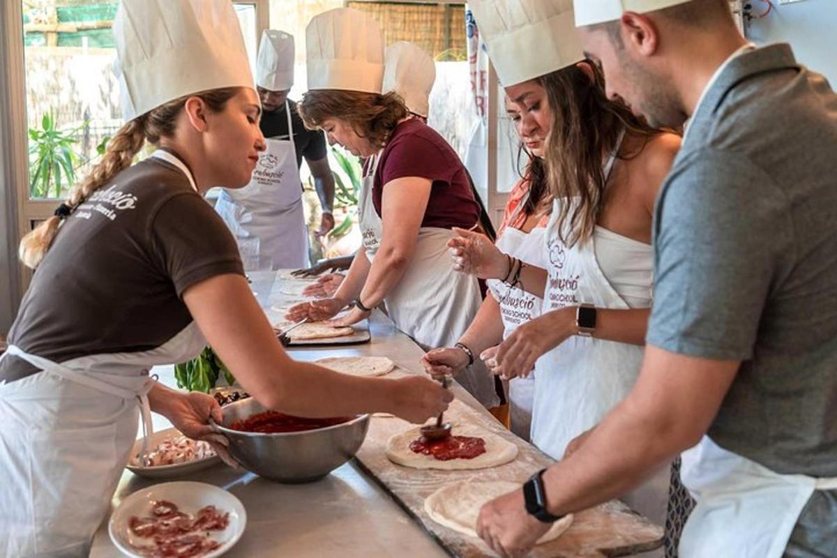 a group of people standing around a kitchen preparing food