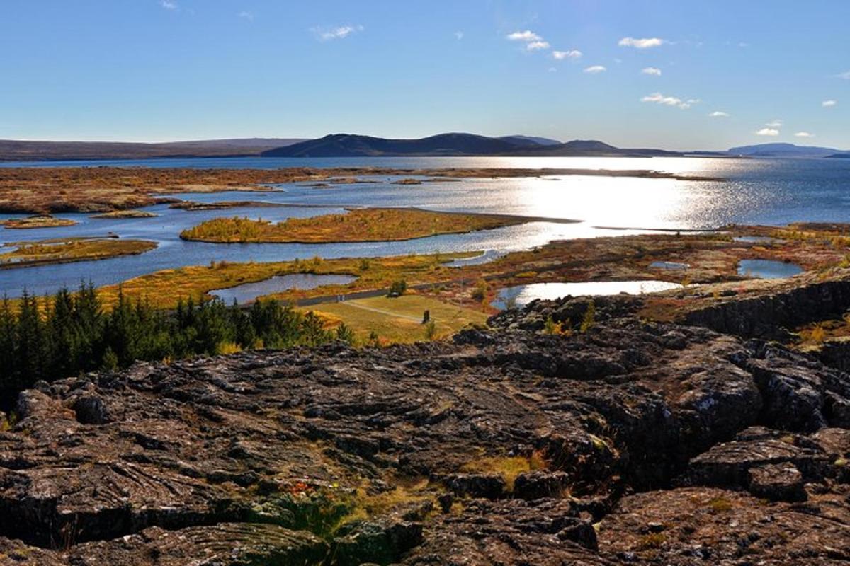 a view of a large body of water with rocks