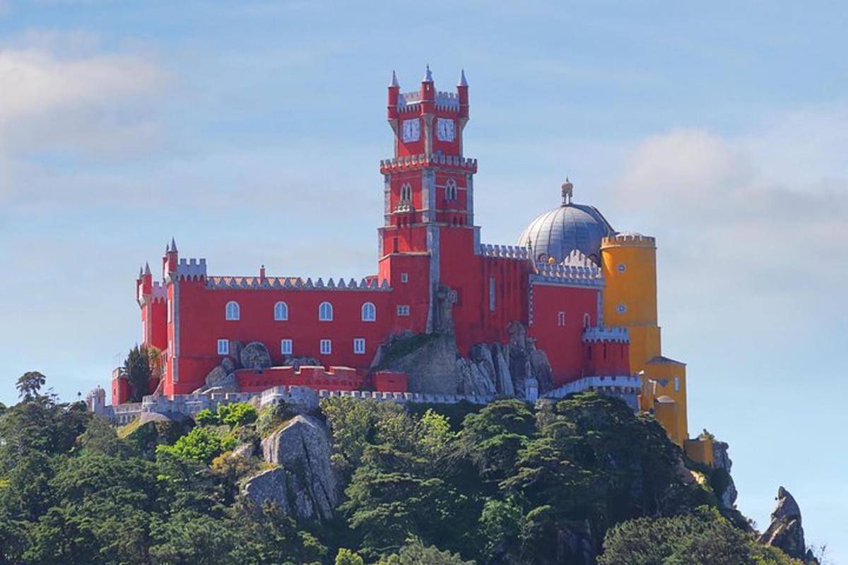 a large red building on top of a mountain
