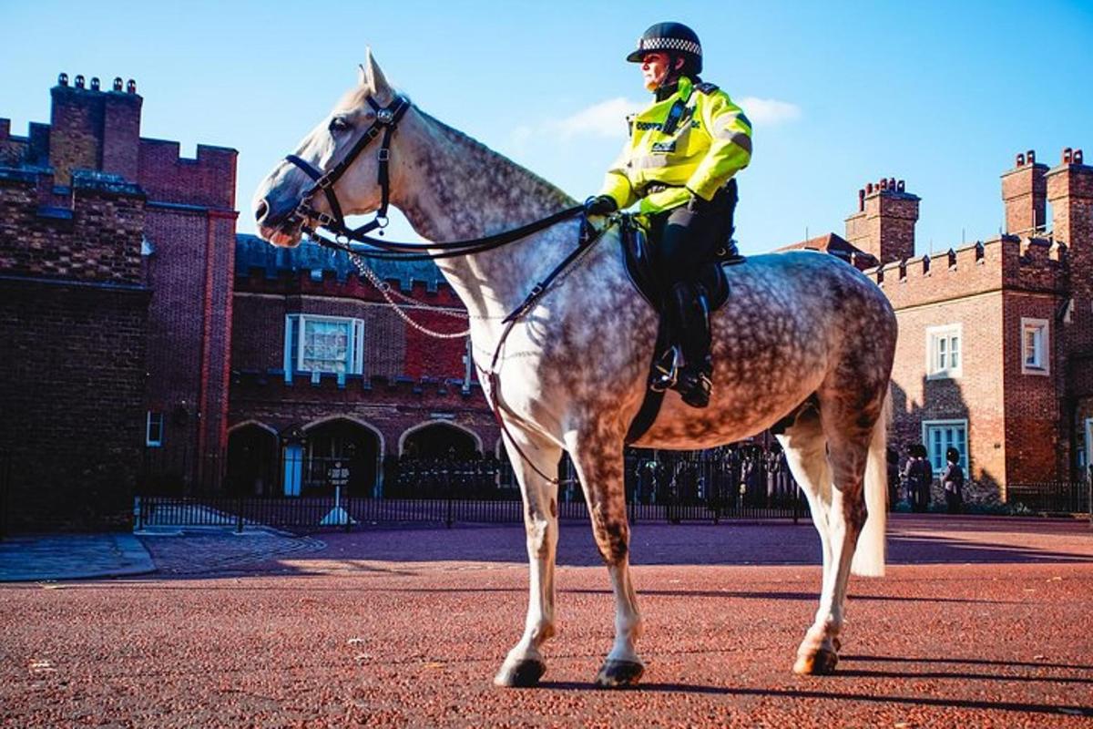 a police officer on a horse in front of a building