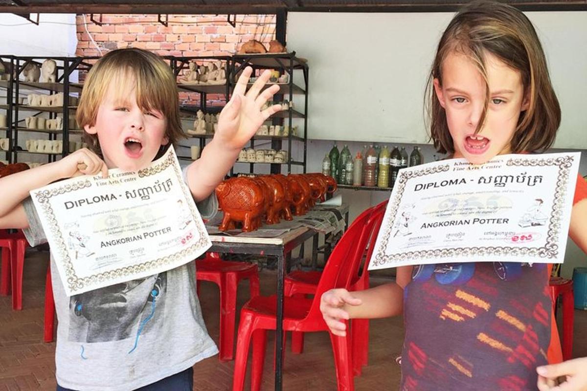 two young children holding up signs in a store