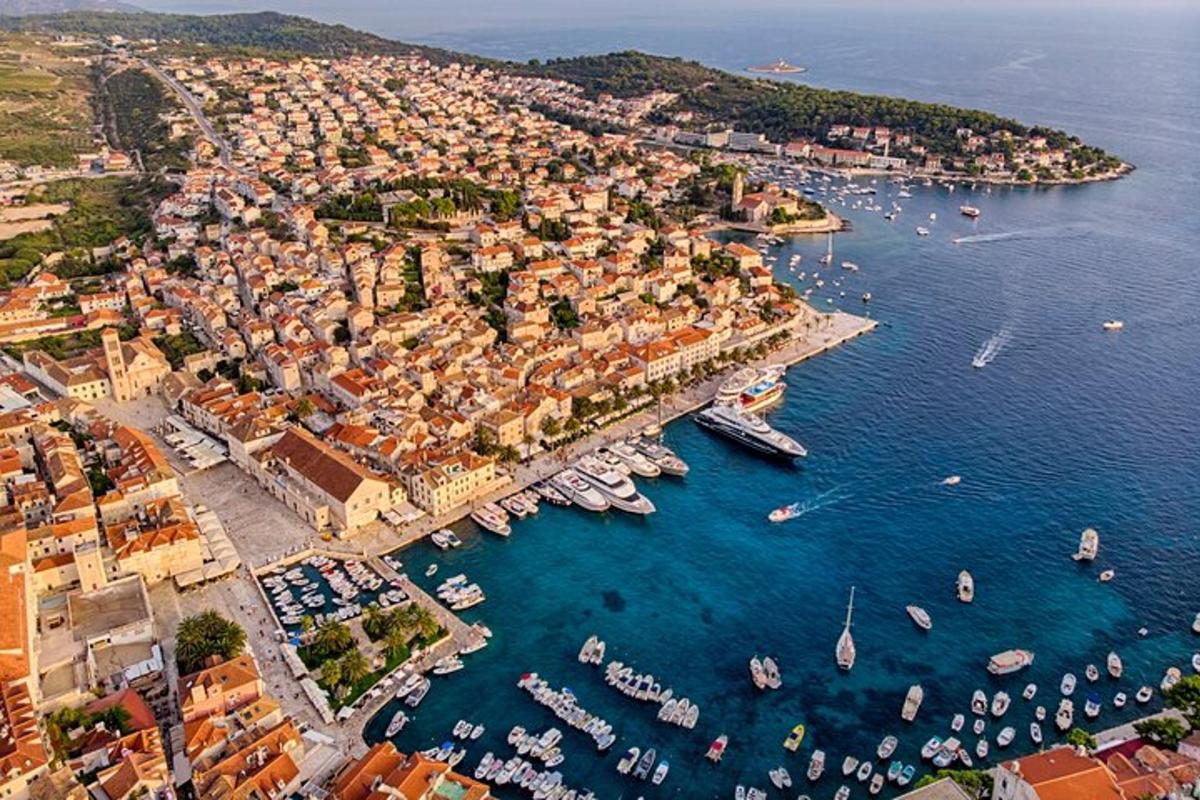 an aerial view of a harbor with boats in the water