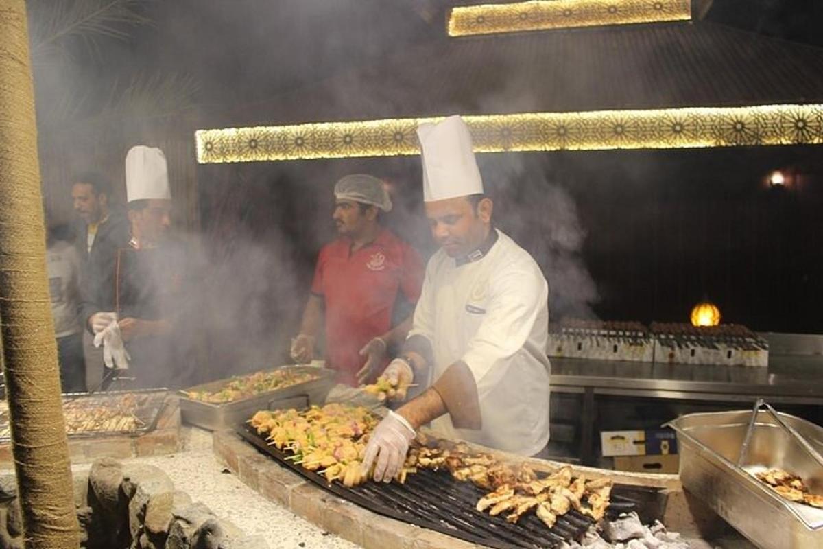 a group of chefs preparing food on a grill