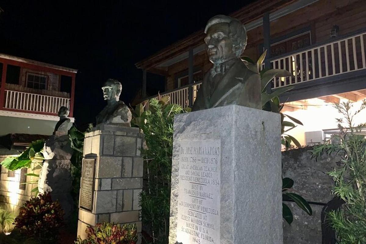 a statue of two men in front of a building