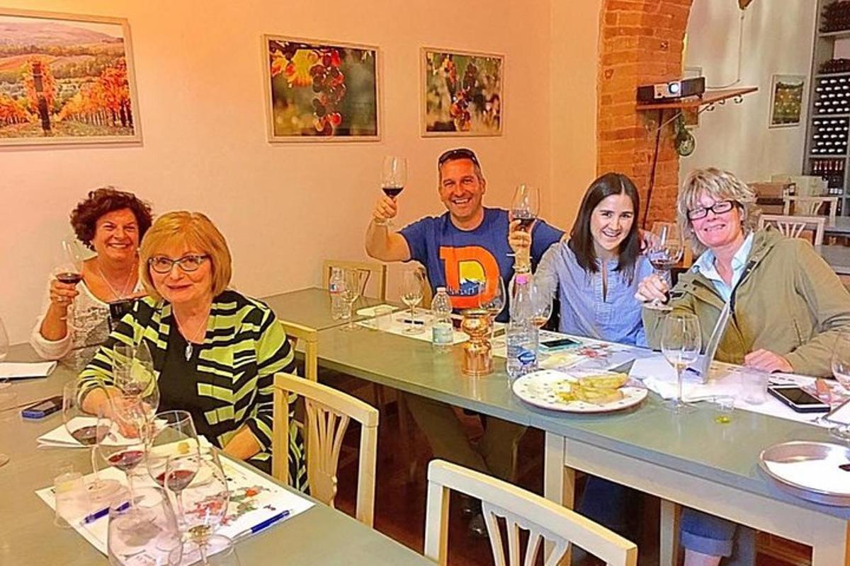 a group of people sitting at a table with wine glasses