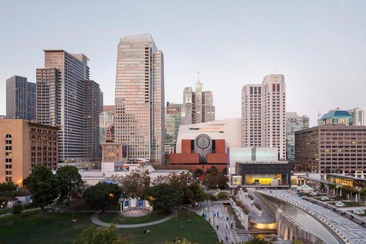 a city skyline with tall buildings and a freeway