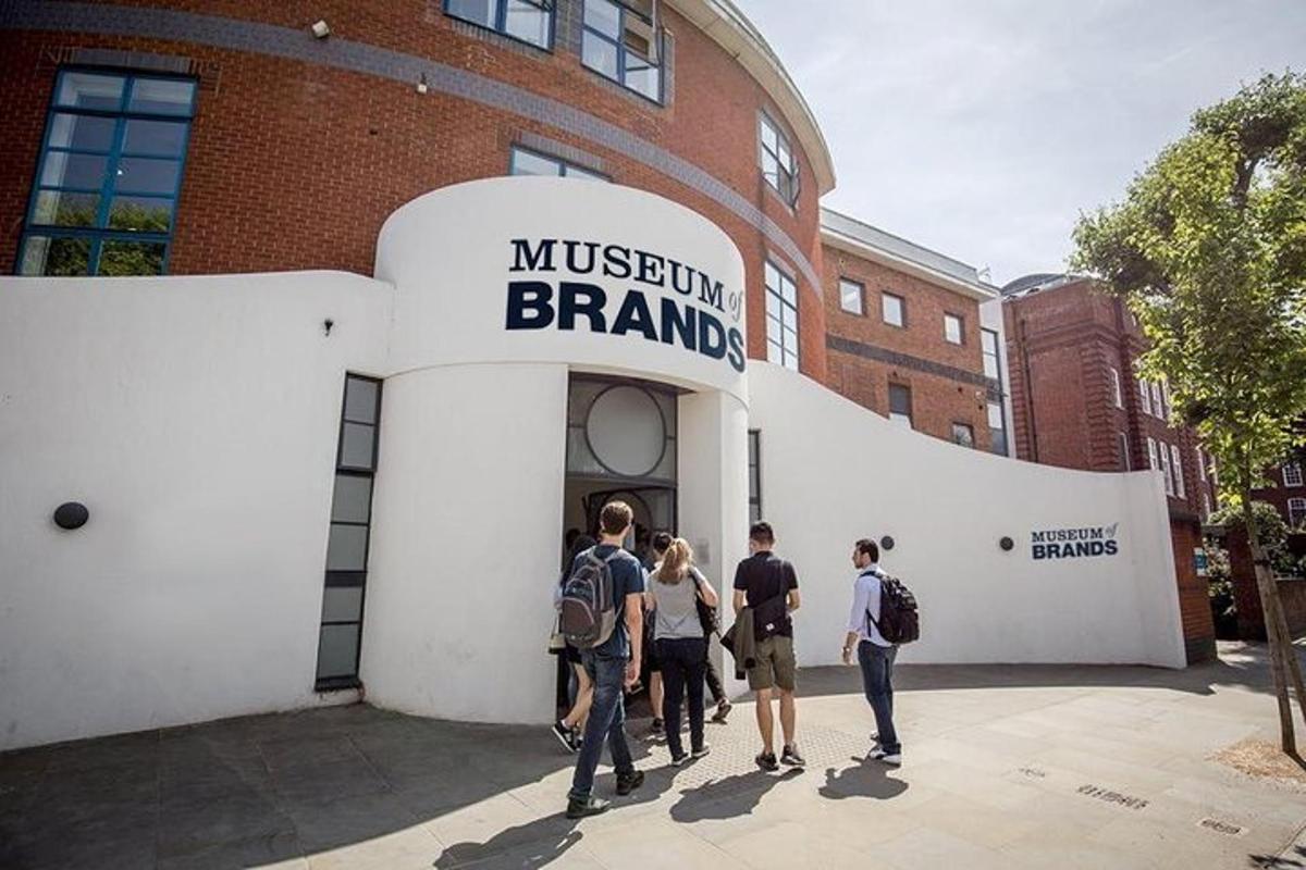 a group of people standing outside of a brick building