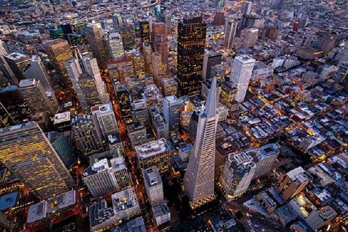 an aerial view of a city with tall buildings