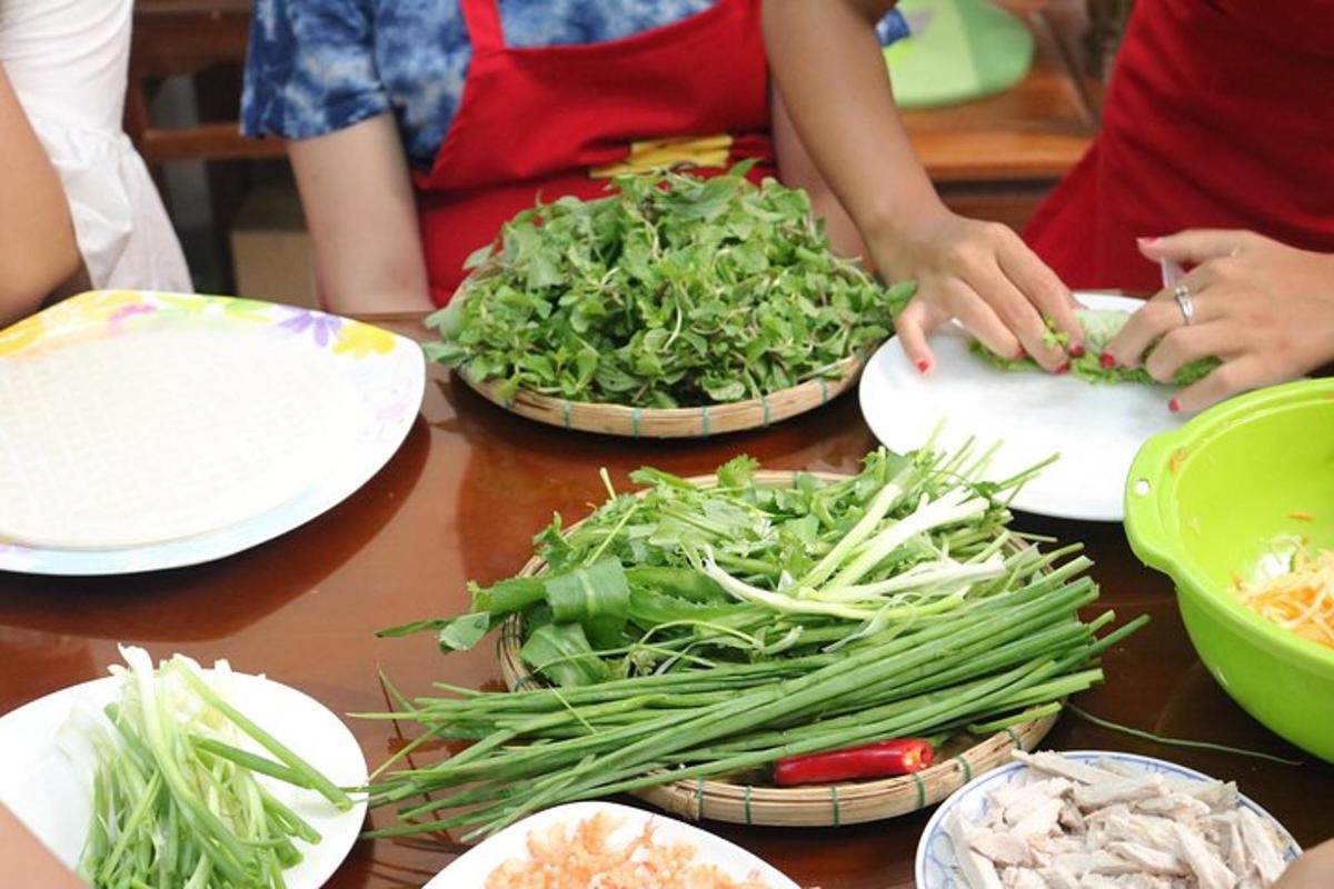 a group of people preparing food on a table