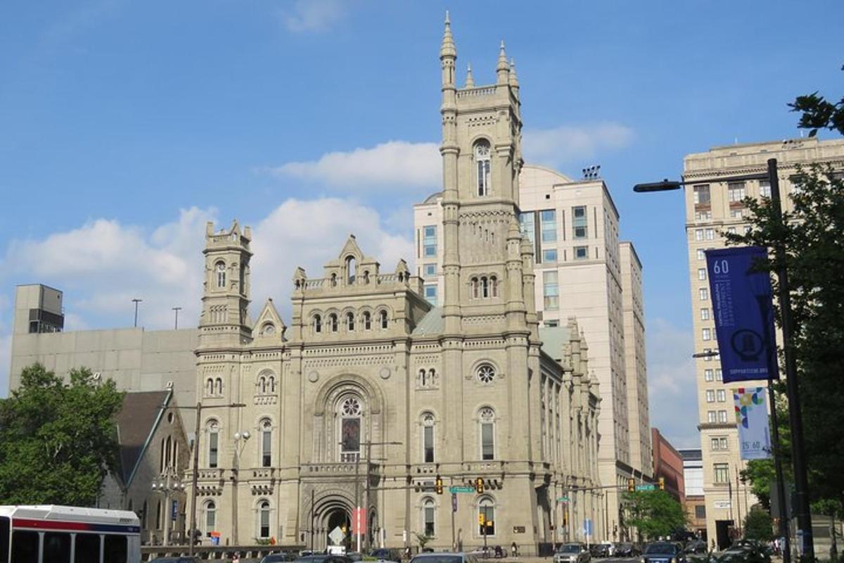 an old building with a clock tower on a street