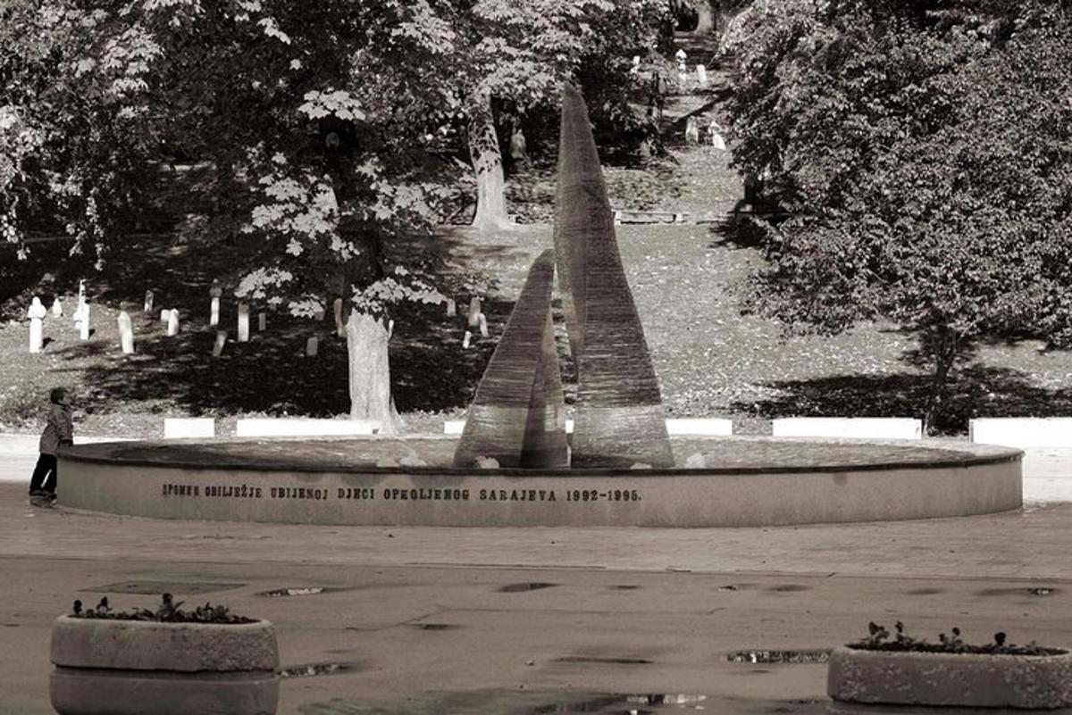 a black and white photo of a monument in a park