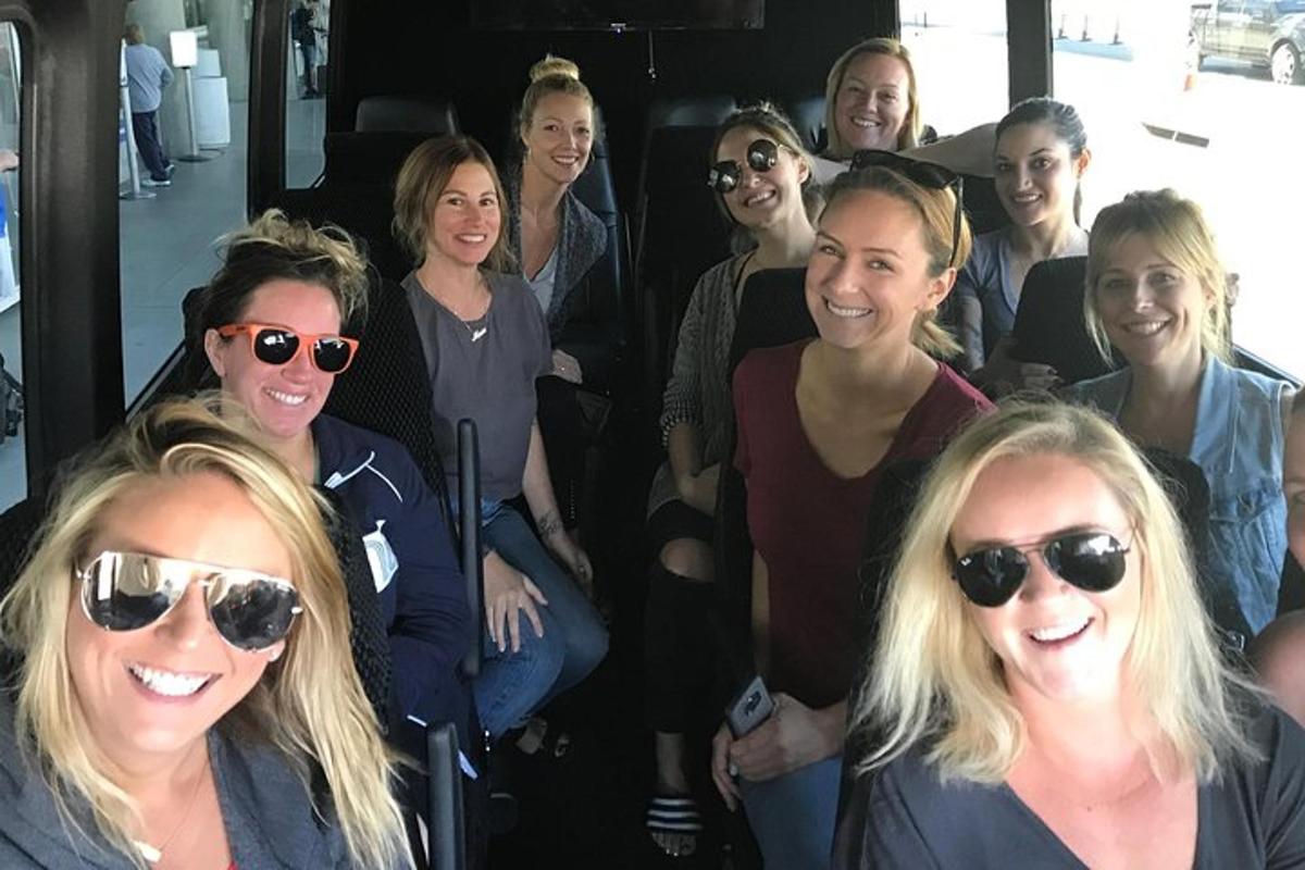 a group of women sitting on a bus