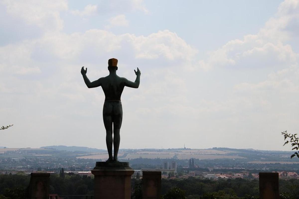 a statue of a woman standing on top of a building
