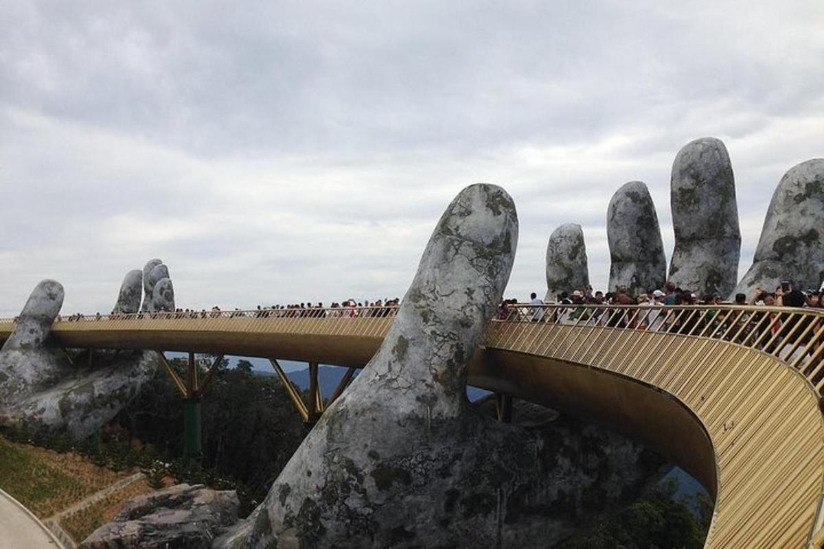 a large span bridge with a giant hand on it