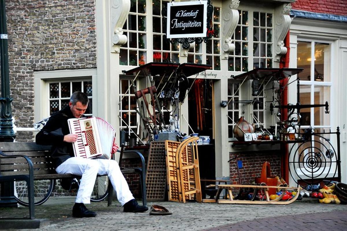 a man sitting on a bench playing an accordion