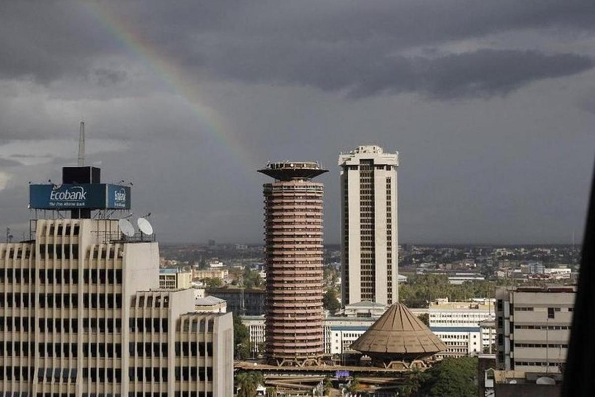 a view of a city with a rainbow in the sky