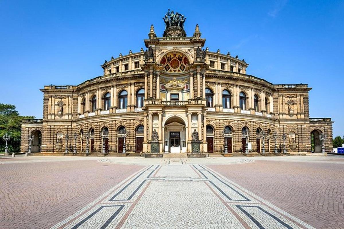 a large stone building on a cobblestone street