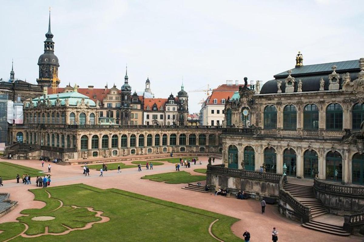 a large building with a park in front of it