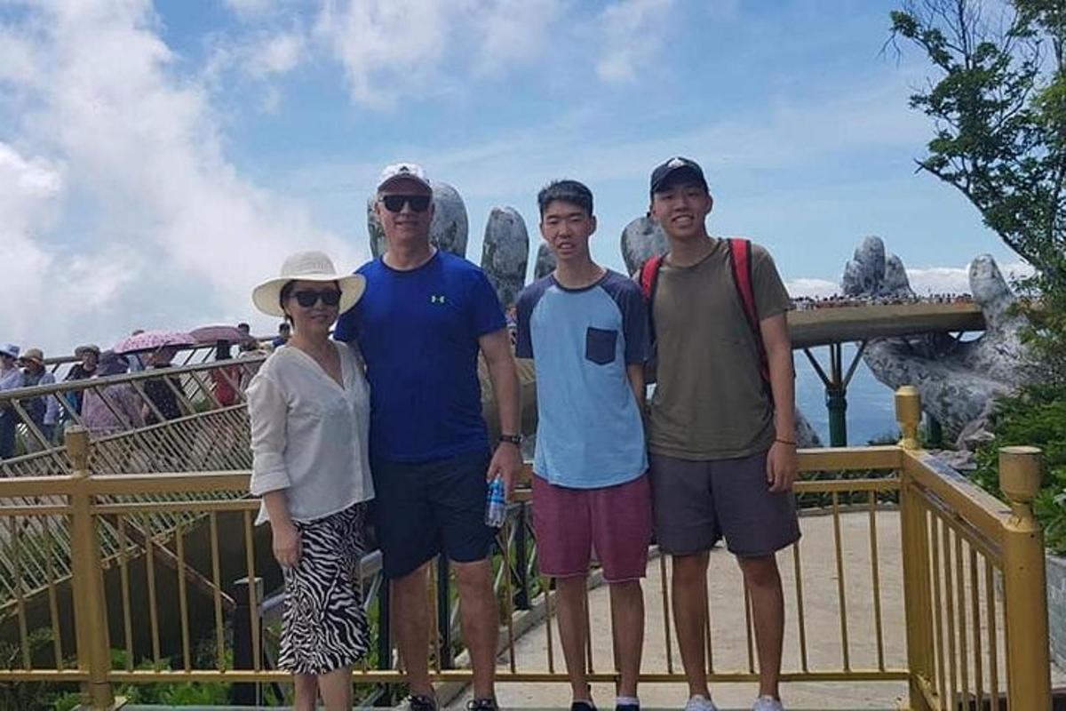a group of people posing for a picture at the theme park