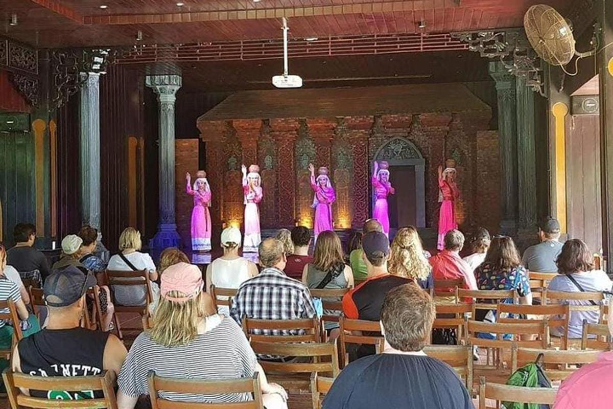 a group of people watching two performers on a stage