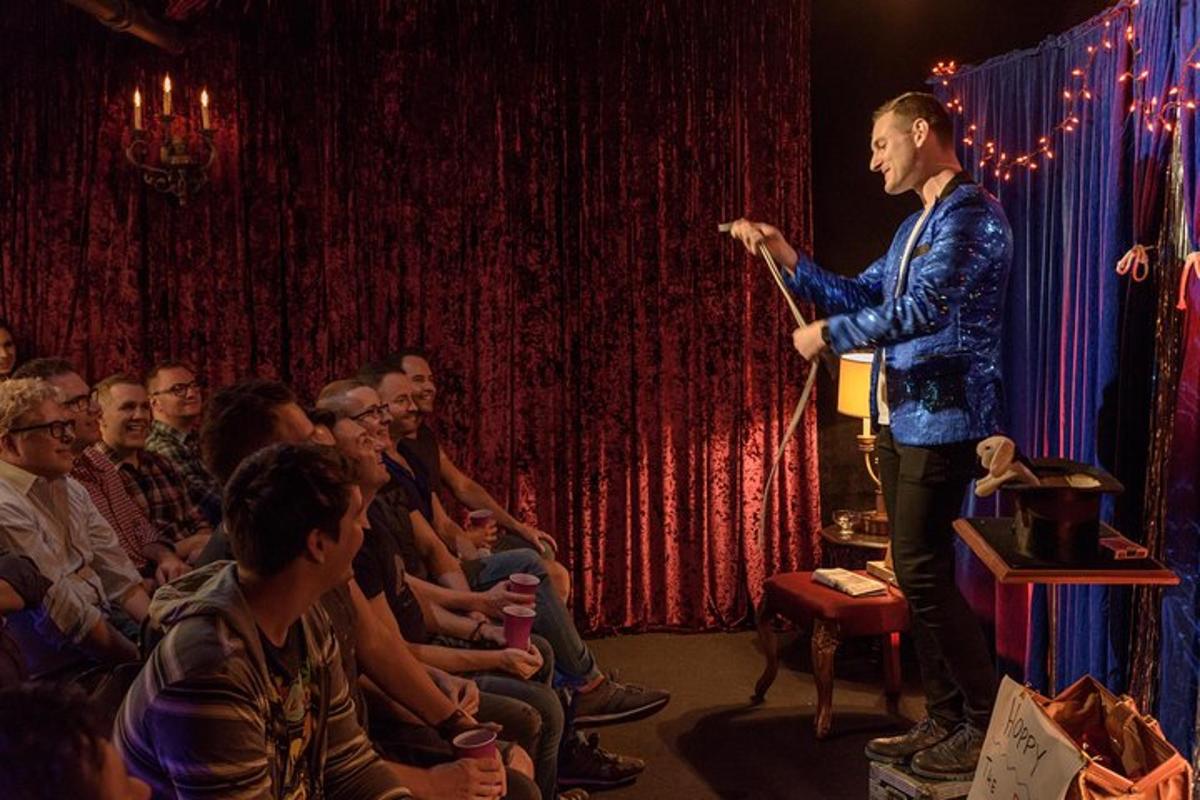 a man standing on a stage in front of a crowd