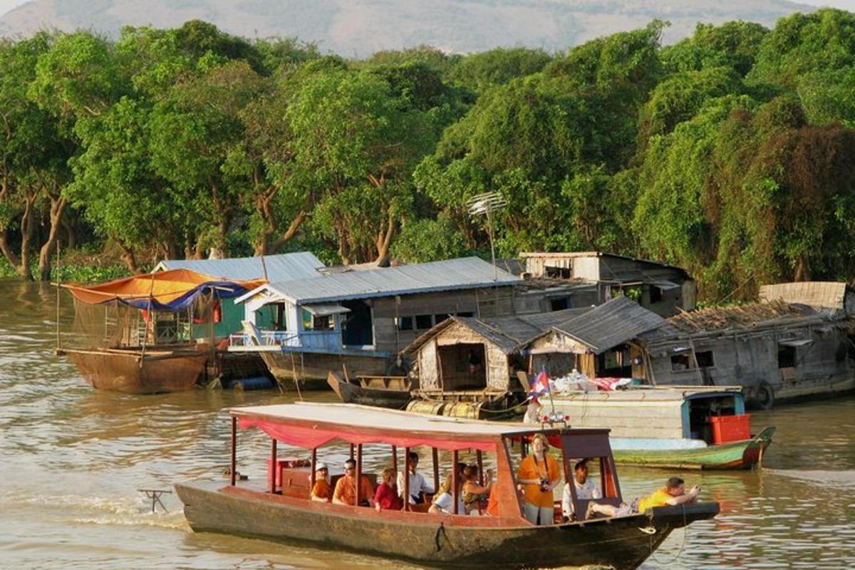 a group of people on a boat in the water