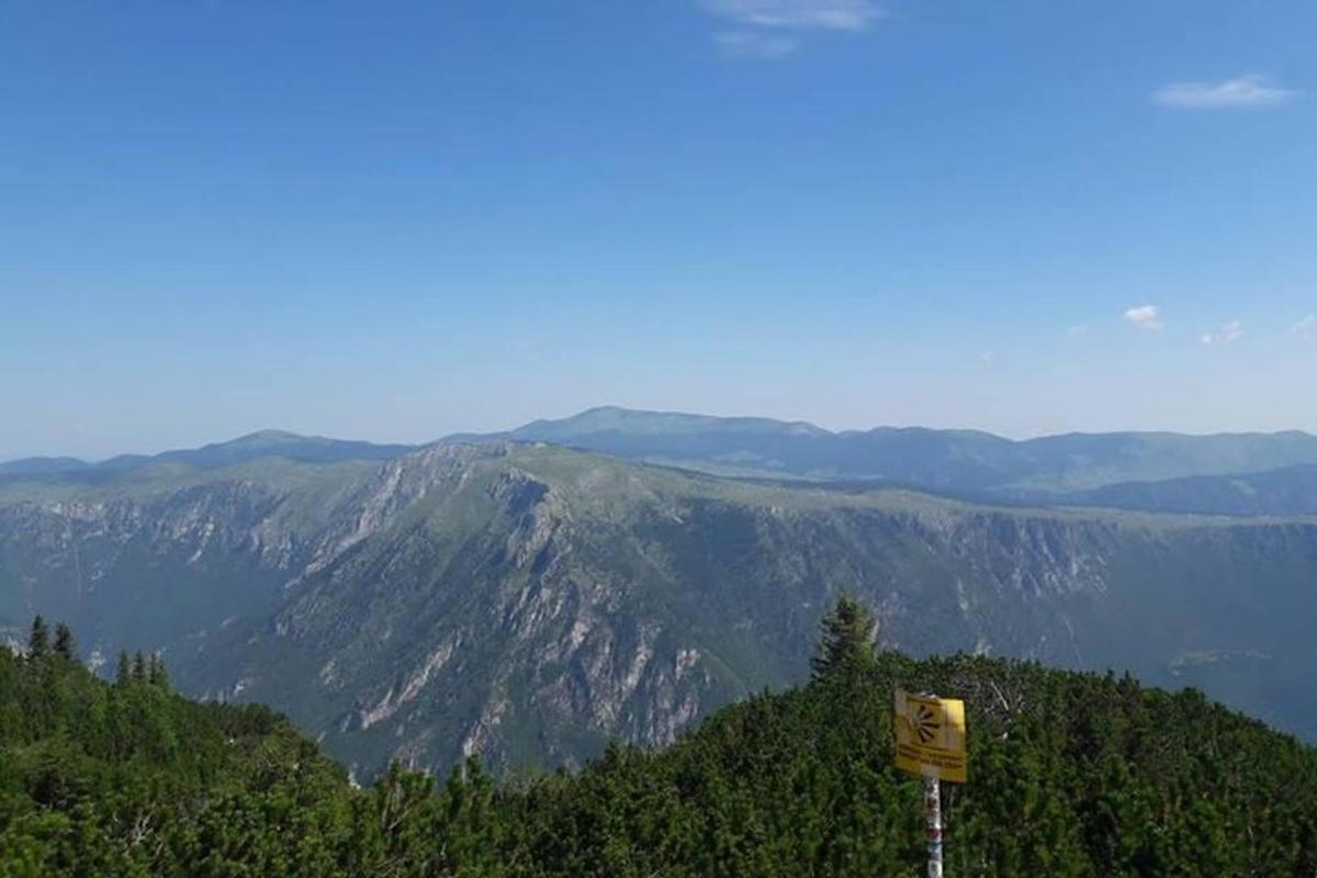 a view of a mountain with a sign on it